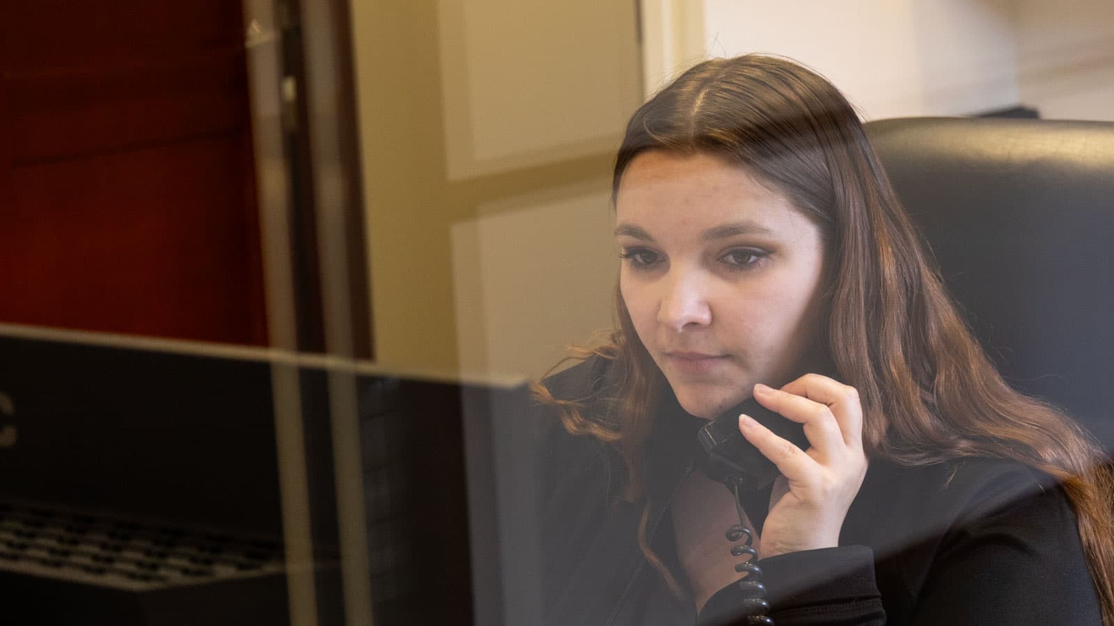 A patient coordinator on the phone
